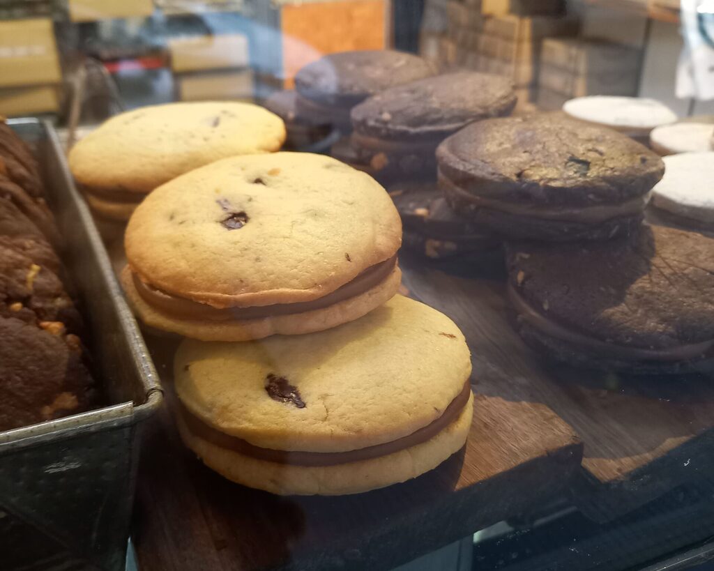 Argentine alfajores on a window display. Alfajores are considered a pastry staple of Buenos Aires Food Culture. Foreigners know them as "Argentinian cookies".