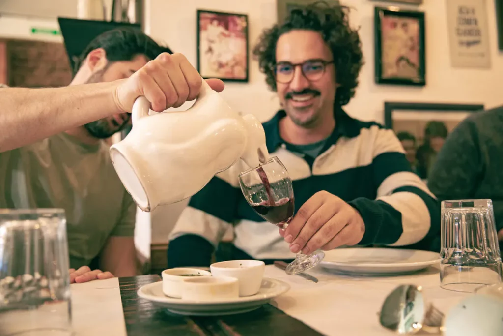 Malbec wine served in a traditional penguin jar.