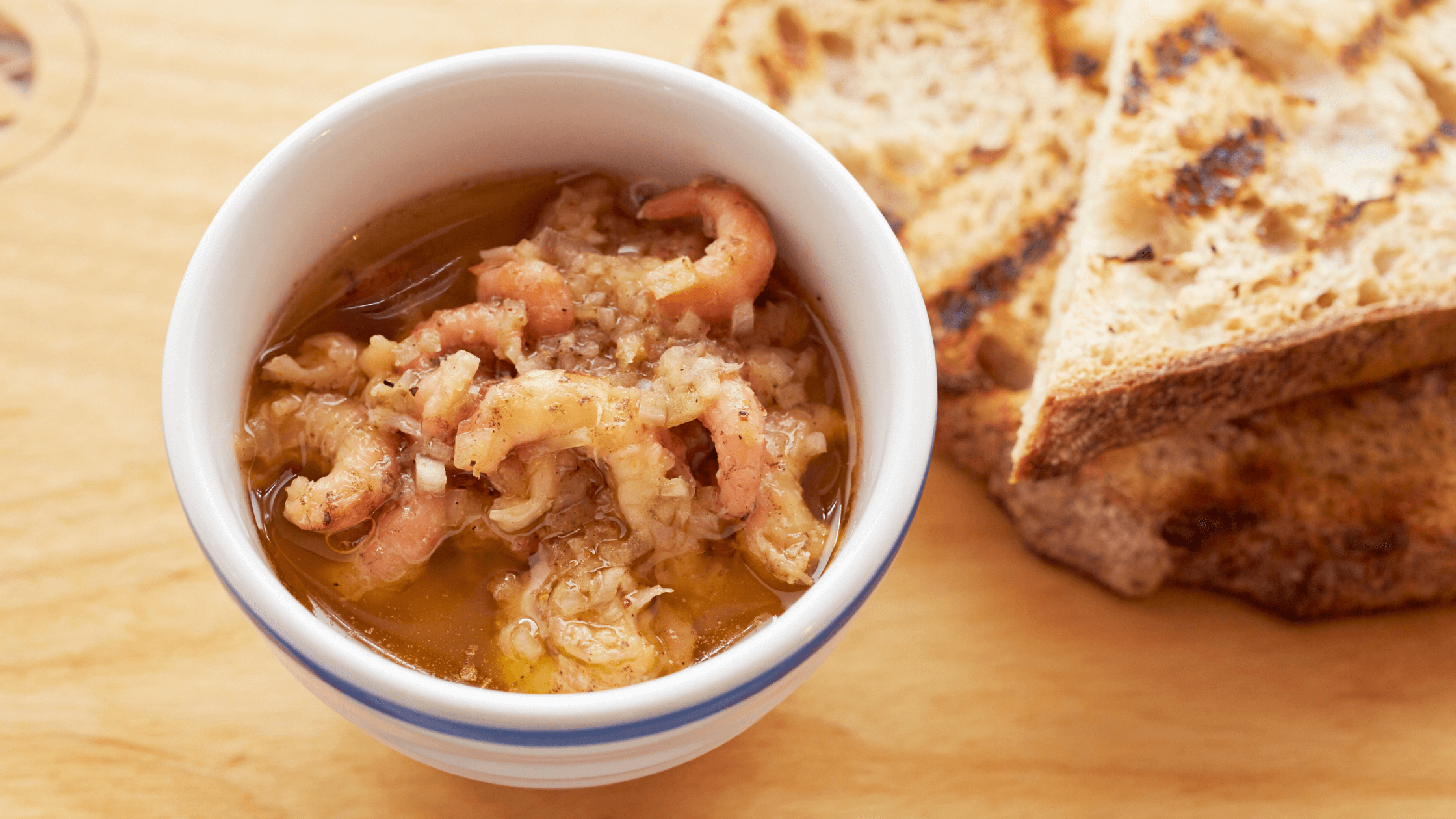 A traditional British dish of cooked shrimp in spiced butter, packed into pots and sealed with clarified butter